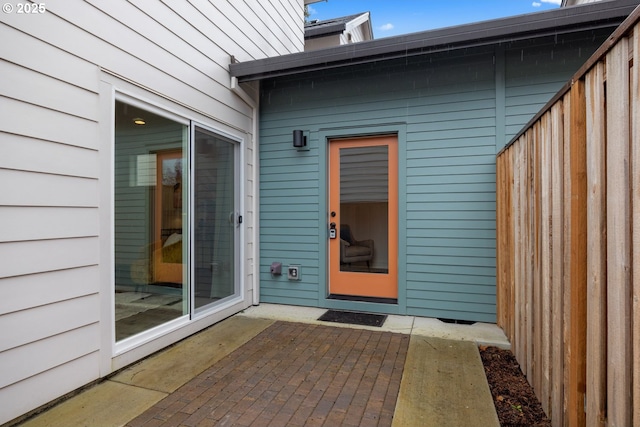 doorway to property with a patio area