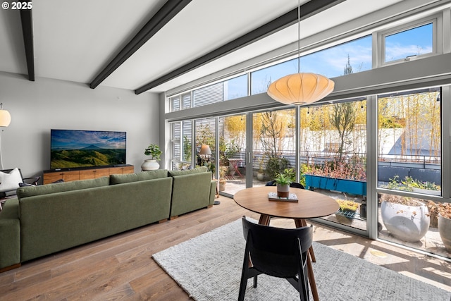 323 NW 13th Ave Unit 404, Portland, OR 97209 - dining space with beamed ceiling and wood finished floors