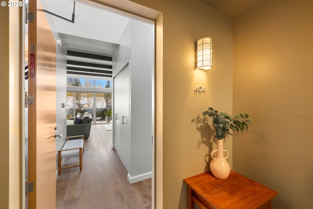 323 NW 13th Ave Unit 404, Portland, OR 97209 - hall featuring wood finished floors and baseboards