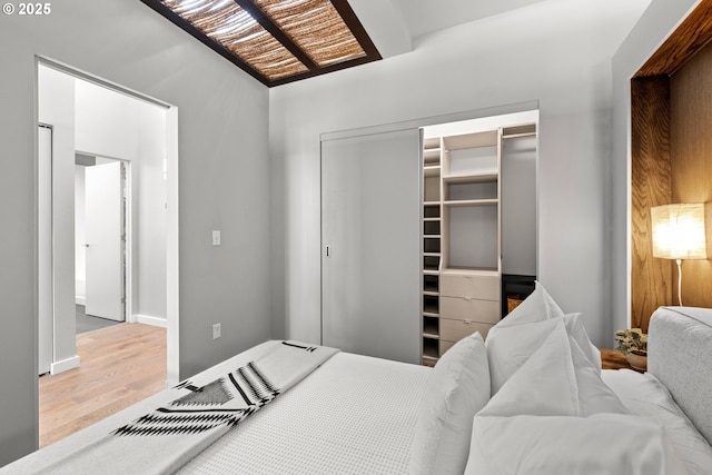 323 NW 13th Ave Unit 404, Portland, OR 97209 - bedroom featuring a closet and wood finished floors