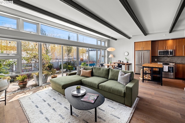 323 NW 13th Ave Unit 404, Portland, OR 97209 - living room with beam ceiling and wood finished floors