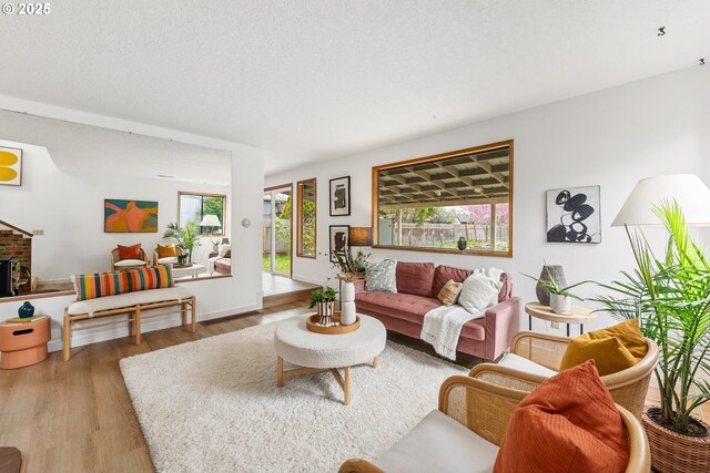 living area with a wealth of natural light and wood finished floors