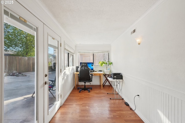office with visible vents, crown molding, and a wealth of natural light