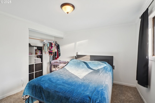 bedroom with carpet floors, crown molding, and baseboards