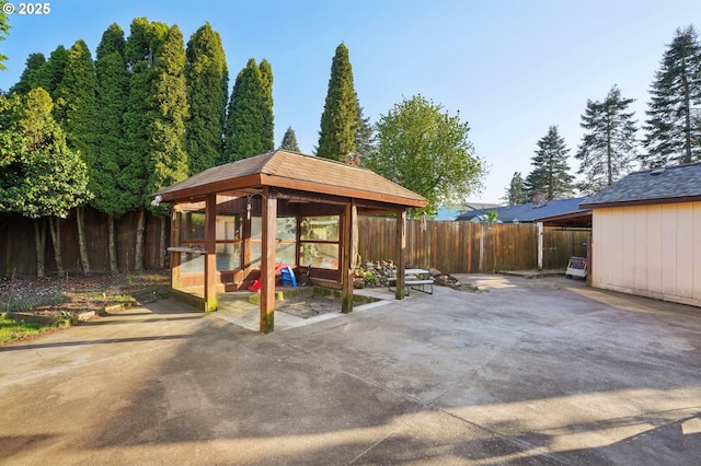 view of patio featuring a gazebo and a fenced backyard