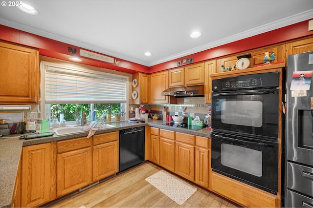 20685 SW Siletz Ct, Tualatin, OR 97062 - kitchen featuring black appliances, under cabinet range hood, crown molding, light wood finished floors, and backsplash