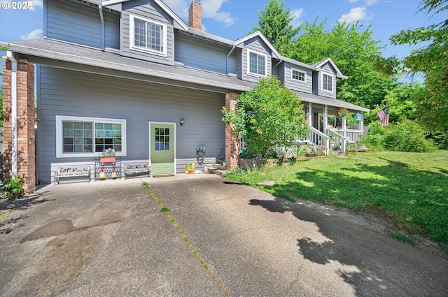 20685 SW Siletz Ct, Tualatin, OR 97062 - view of front of home featuring a chimney, a front lawn, and a porch
