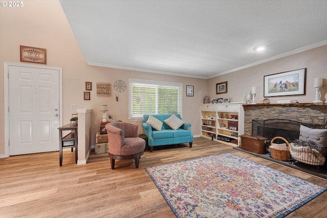 20685 SW Siletz Ct, Tualatin, OR 97062 - living room featuring light wood-style flooring, ornamental molding, a fireplace, and baseboards