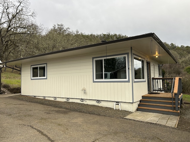 view of side of property with crawl space