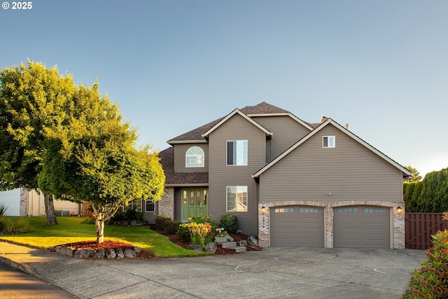 12015 SE Regal Ct, Clackamas, OR 97015 - traditional-style house with concrete driveway, a garage, roof with shingles, and brick siding
