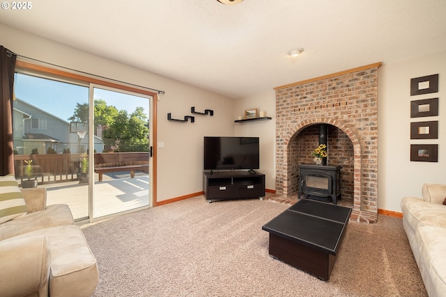 12015 SE Regal Ct, Clackamas, OR 97015 - carpeted living area featuring a wood stove and baseboards