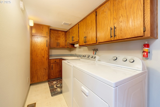 12015 SE Regal Ct, Clackamas, OR 97015 - laundry area with cabinet space, light floors, and independent washer and dryer