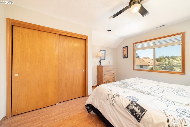 12015 SE Regal Ct, Clackamas, OR 97015 - bedroom featuring lofted ceiling, light wood-type flooring, a closet, and ceiling fan