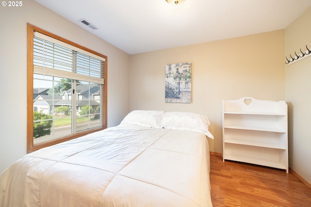 12015 SE Regal Ct, Clackamas, OR 97015 - bedroom with wood finished floors and baseboards