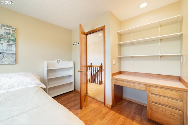 12015 SE Regal Ct, Clackamas, OR 97015 - bedroom with light wood-type flooring and built in desk