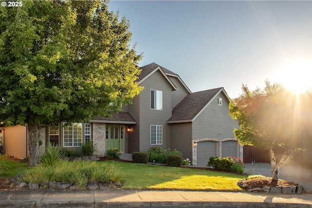 12015 SE Regal Ct, Clackamas, OR 97015 - traditional-style house featuring a garage, roof with shingles, and concrete driveway