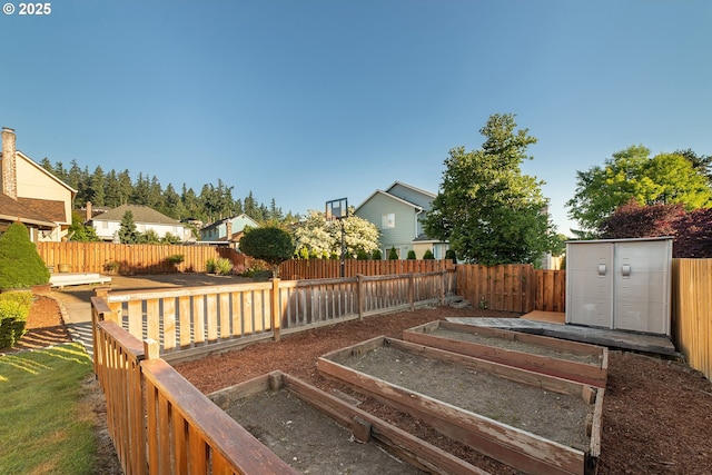 12015 SE Regal Ct, Clackamas, OR 97015 - fenced backyard featuring a garden and a shed