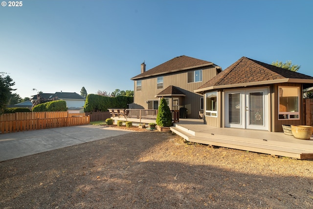 12015 SE Regal Ct, Clackamas, OR 97015 - back of house with a deck, french doors, and a shingled roof