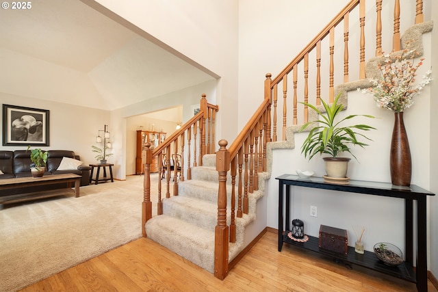 12015 SE Regal Ct, Clackamas, OR 97015 - staircase with wood finished floors and high vaulted ceiling