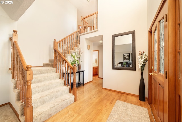12015 SE Regal Ct, Clackamas, OR 97015 - foyer with stairs, a high ceiling, and light wood finished floors