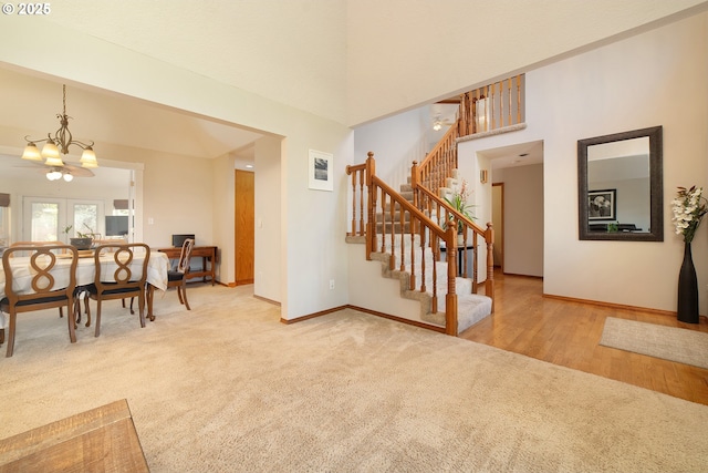 12015 SE Regal Ct, Clackamas, OR 97015 - entryway with light carpet, a chandelier, and stairway