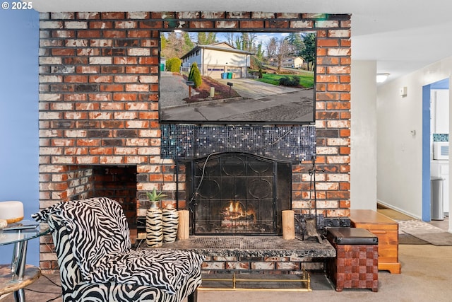 interior space featuring a brick fireplace and carpet flooring