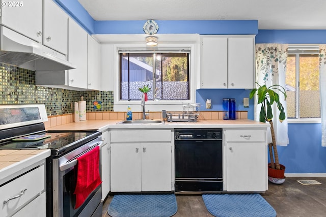 kitchen featuring dishwasher, decorative backsplash, sink, white cabinets, and stainless steel range with electric cooktop