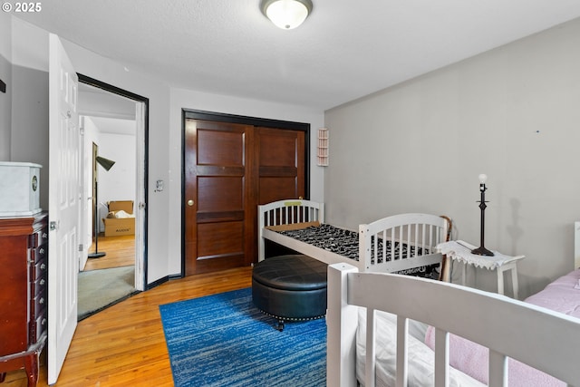 bedroom featuring hardwood / wood-style flooring