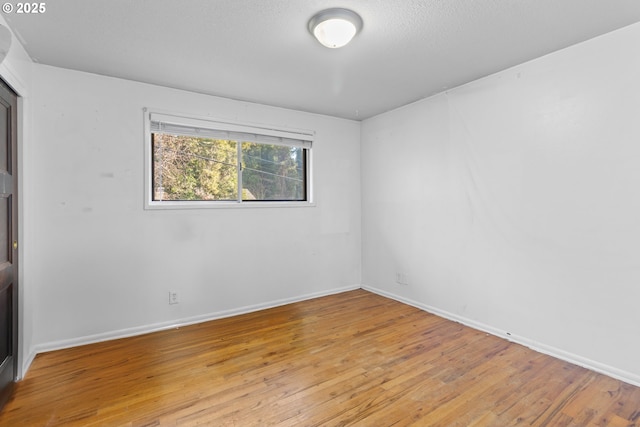 unfurnished room featuring light hardwood / wood-style floors