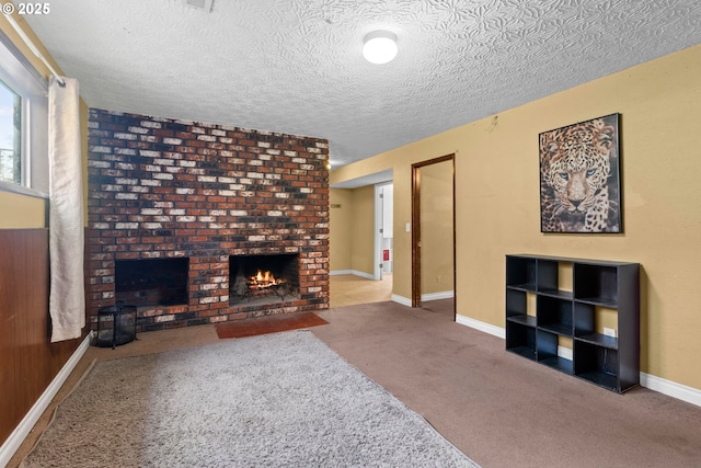 living room with a brick fireplace, a textured ceiling, and light carpet