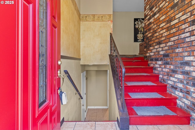 stairs with tile patterned flooring