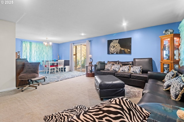 carpeted living room featuring a chandelier