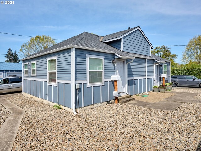 178 S Main St, Lebanon, OR 97355 - view of side of property featuring entry steps and roof with shingles