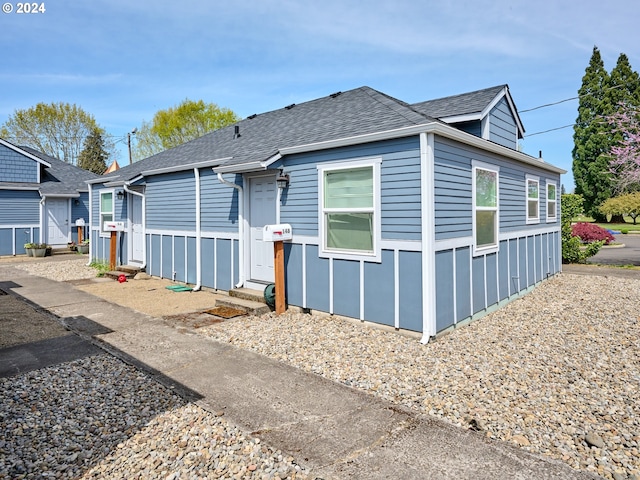 178 S Main St, Lebanon, OR 97355 - view of front of home with a shingled roof and entry steps