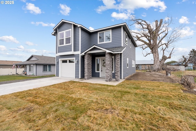 view of front of house with a garage and a front lawn