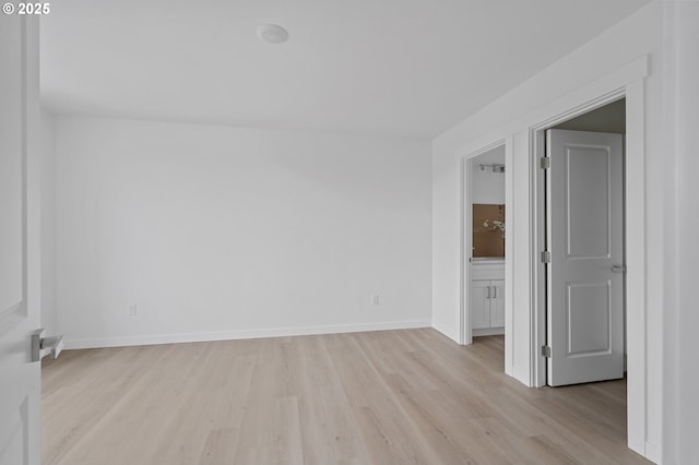 spare room featuring light hardwood / wood-style flooring