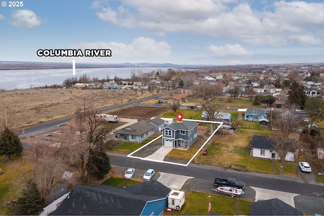 bird's eye view with a water view