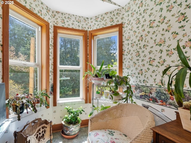 interior space featuring a wealth of natural light and wallpapered walls