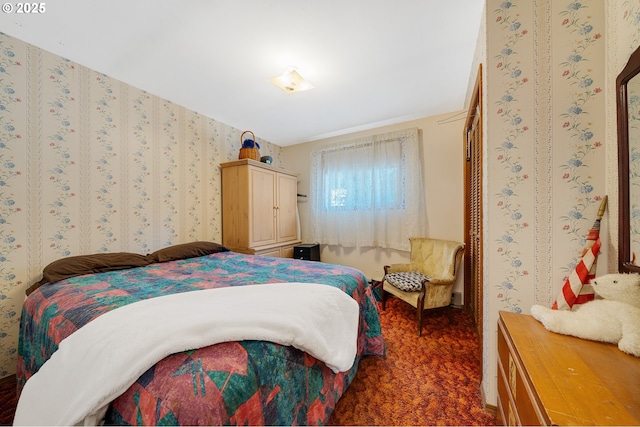 bedroom featuring carpet flooring and wallpapered walls