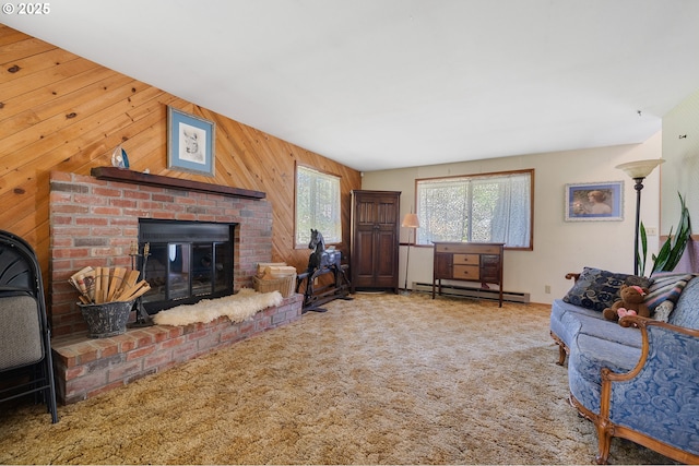 carpeted living area featuring a brick fireplace, wood walls, and a baseboard radiator