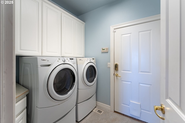 20700 SE Cherry Blossom Ln, Amity, OR 97101 - washroom featuring cabinet space and washer and dryer