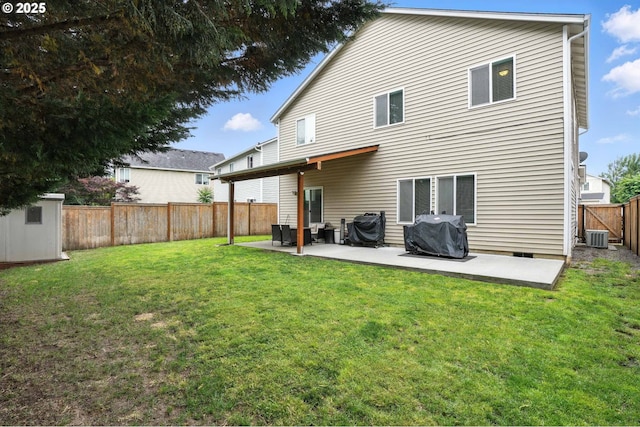 2137 N Q St, Washougal, WA 98671 - rear view of house featuring a patio area, a fenced backyard, and a storage unit