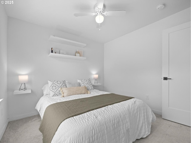 bedroom featuring light carpet and ceiling fan