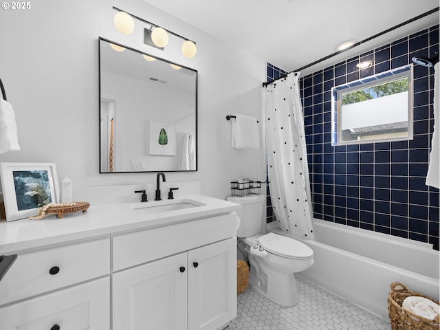 full bathroom with shower / tub combo with curtain, vanity, toilet, and tile patterned flooring