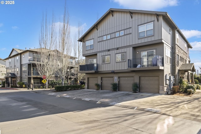 rear view of property with a garage