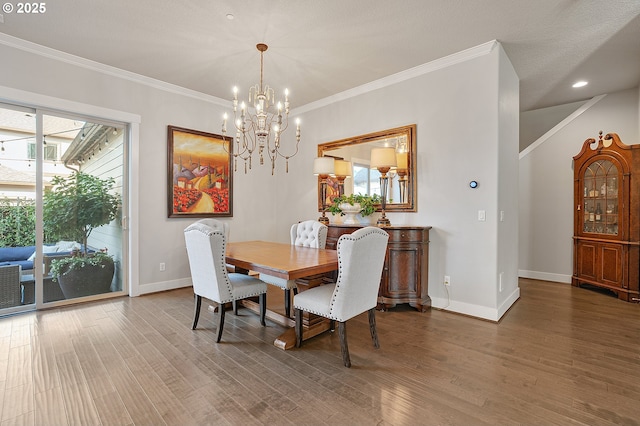 12339 SW Waterford Loop, Wilsonville, OR 97070 - dining room featuring a chandelier, baseboards, wood finished floors, ornamental molding, and recessed lighting