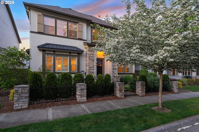 12339 SW Waterford Loop, Wilsonville, OR 97070 - view of front of house featuring stucco siding, a standing seam roof, stone siding, and metal roof