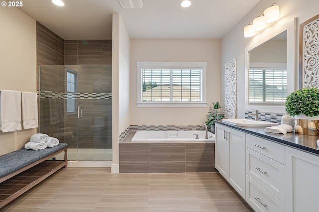 12339 SW Waterford Loop, Wilsonville, OR 97070 - bathroom with vanity, recessed lighting, a bath, tile patterned floors, and a shower stall