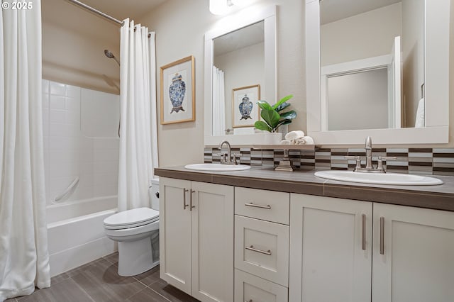 12339 SW Waterford Loop, Wilsonville, OR 97070 - bathroom featuring double vanity, shower / bath combo, decorative backsplash, and toilet