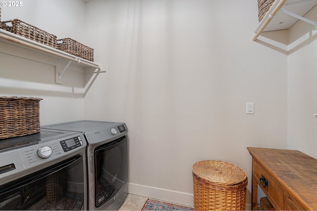 12339 SW Waterford Loop, Wilsonville, OR 97070 - laundry area with baseboards and washing machine and clothes dryer